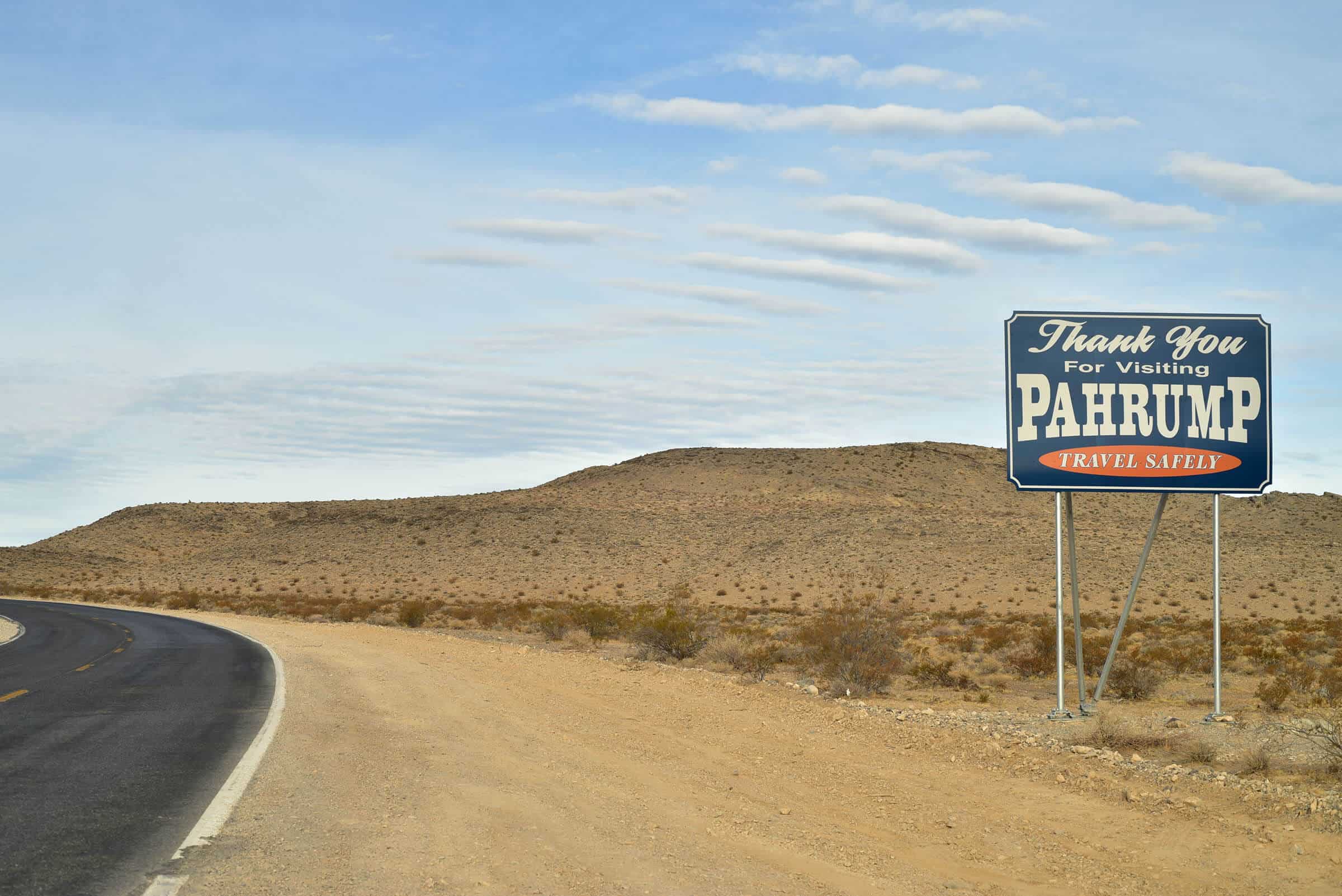 Decorative header image featuring the welcome to Pahrump sign with mountains in the distance